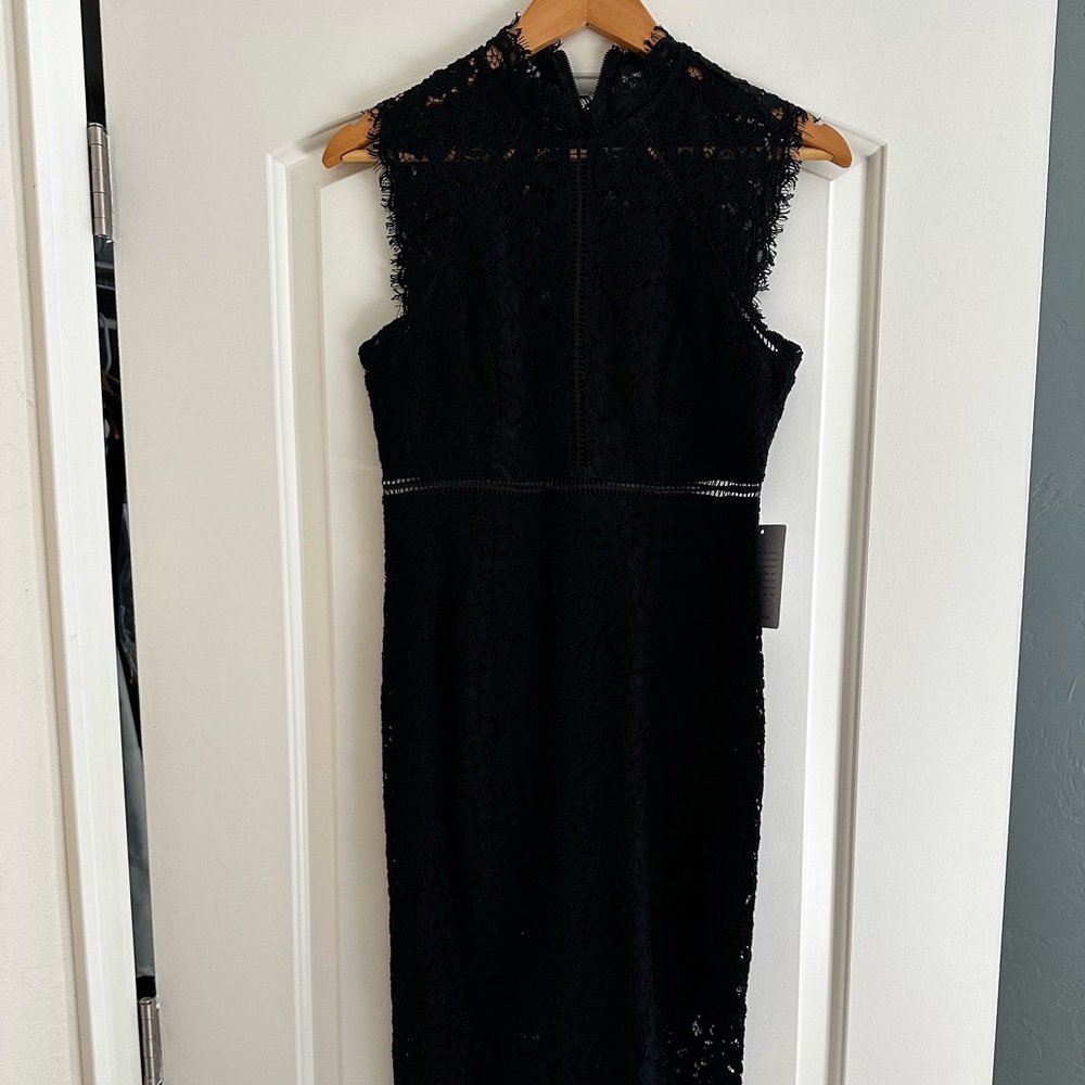 New with tags. Never worn black dress still available at Nordstrom full price.